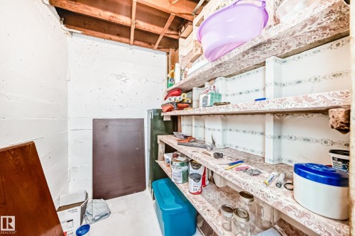 Unfinished basement space featuring exposed wood joists and concrete walls - 4006 115 Avenue, Edmonton, AB 