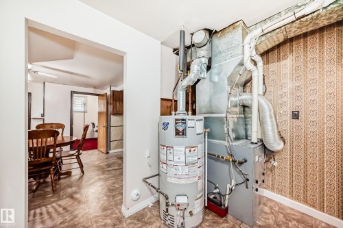 Utility area featuring a water heater and furnace unit - 4006 115 Avenue, Edmonton, AB 
