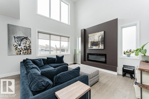 74 Ellice Bend, Fort Saskatchewan, AB - Indoor Photo Showing Living Room With Fireplace