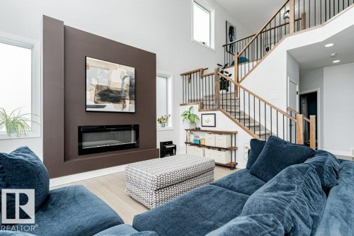 74 Ellice Bend, Fort Saskatchewan, AB - Indoor Photo Showing Living Room With Fireplace
