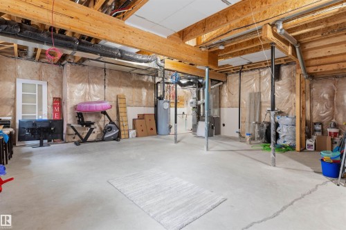 Expansive unfinished basement featuring exposed wood joists and concrete flooring, offering substantial potential for future customization - 3312 11 Avenue, Edmonton, AB - Indoor Photo Showing Basement