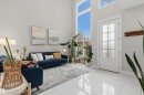 Two-story living area featuring large format white tile flooring and high ceilings - 3312 11 Avenue, Edmonton, AB  - Indoor 