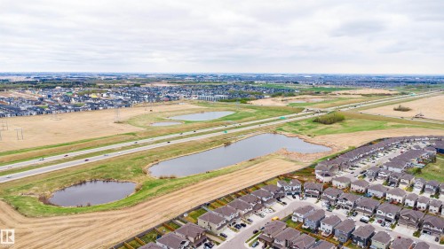 Aerial perspective showcasing a residential development with multiple detached homes - 3312 11 Avenue, Edmonton, AB - Outdoor With View