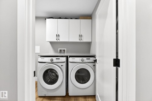207 7463 May Common, Edmonton, AB - Indoor Photo Showing Laundry Room
