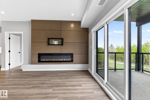 207 7463 May Common, Edmonton, AB - Indoor With Fireplace