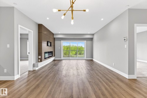 207 7463 May Common, Edmonton, AB - Indoor With Fireplace