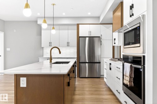 207 7463 May Common, Edmonton, AB - Indoor Photo Showing Kitchen With Stainless Steel Kitchen With Upgraded Kitchen