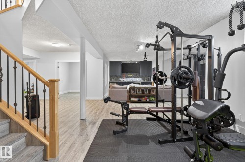 Dedicated fitness area featuring rubber flooring - 34 Valleyview Ridge, Fort Saskatchewan, AB - Indoor Photo Showing Gym Room