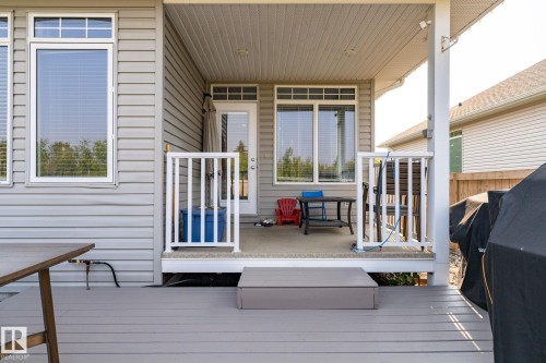 Tiered outdoor living space featuring a covered patio and an open deck - 34 Valleyview Ridge, Fort Saskatchewan, AB - Outdoor With Deck Patio Veranda With Exterior