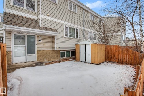 The property features a fenced yard, a storage shed, and a covered entry - 6F Castle Terrace, Edmonton, AB - Outdoor