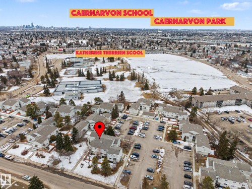 Aerial view of the property and its surrounding area, featuring a park and a school in the vicinity - 6F Castle Terrace, Edmonton, AB - Outdoor With View