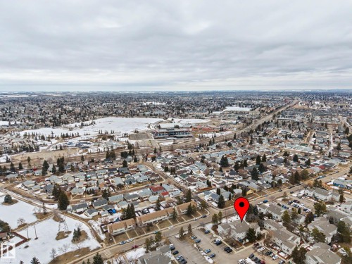 Aerial view showcasing the surrounding neighborhood, featuring residential properties, roads, and open spaces - 6F Castle Terrace, Edmonton, AB - Outdoor With View