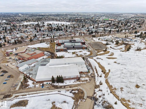Aerial view of the surrounding neighborhood, featuring residential areas with trees, and several institutional buildings - 6F Castle Terrace, Edmonton, AB - Outdoor With View
