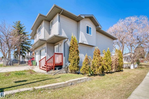 Two-story property featuring light grey siding and a multi-level roofline - 15504 102 Avenue Nw, Edmonton, AB - Outdoor