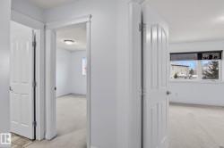 Interior hallway with multiple doorways offering access to individual rooms - 