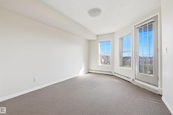 Room featuring light gray carpeting and white walls - 