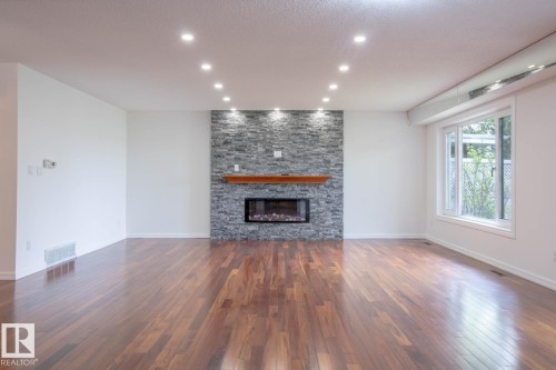 7007 10 Avenue, Edmonton, AB - Indoor Photo Showing Living Room With Fireplace