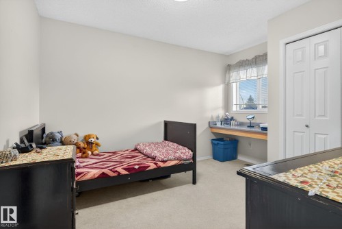 Light-filled room featuring soft neutral wall tones and a window with exterior visibility - 3912 31 Street, Edmonton, AB 