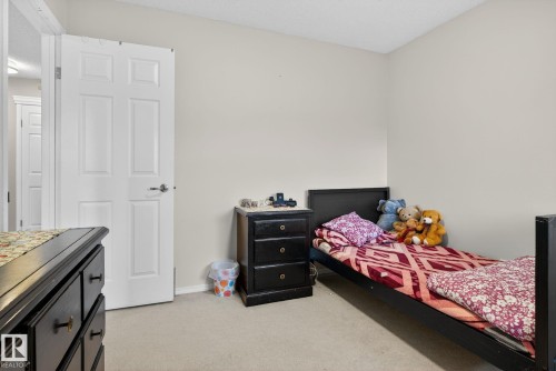 Neutral-toned wall paint complements the light-colored carpeting - 3912 31 Street, Edmonton, AB 