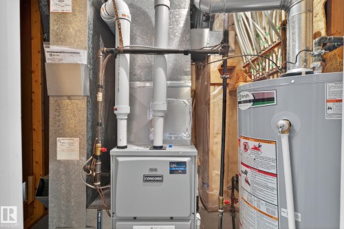 Concord brand furnace with associated ductwork and a water heater - 3912 31 Street, Edmonton, AB 
