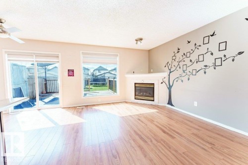 2920 30 Street, Edmonton, AB - Indoor Photo Showing Living Room With Fireplace