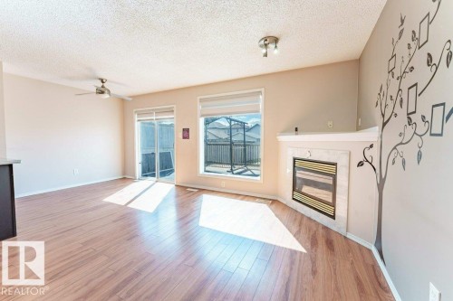 2920 30 Street, Edmonton, AB - Indoor Photo Showing Living Room With Fireplace