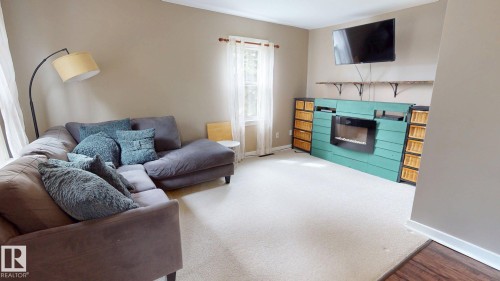 55268 Range Road 212, Rural Strathcona County, AB - Indoor Photo Showing Living Room With Fireplace