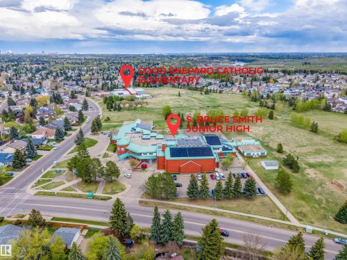 Expansive aerial showcasing a residential neighborhood with broad streets and ample green spaces - 18648 57 Avenue, Edmonton, AB - Outdoor With View