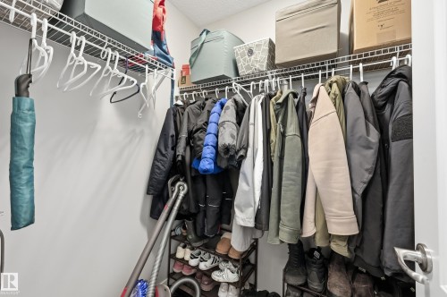 Efficient closet organization system featuring white wire shelving and hanging rods - 3457 Cutler Crescent, Edmonton, AB - Indoor With Storage