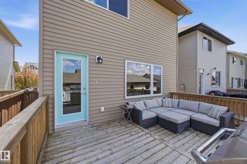 Spacious outdoor deck featuring wooden railing and light-colored siding - 3457 Cutler Crescent, Edmonton, AB - Outdoor With Deck Patio Veranda With Exterior