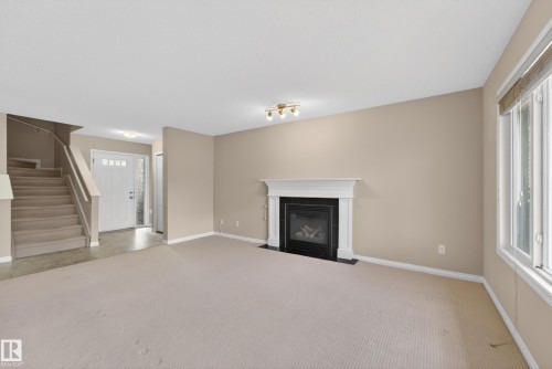 1731 55 Street, Edmonton, AB - Indoor Photo Showing Other Room With Fireplace