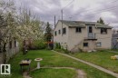 Spacious rear yard featuring an established flowering tree and mature perimeter foliage - 11614 70 Street, Edmonton, AB  - Outdoor 