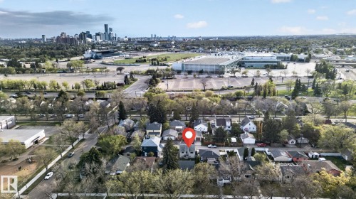 Aerial perspective showcasing a residential neighborhood with a distant cityscape - 11614 70 Street, Edmonton, AB 