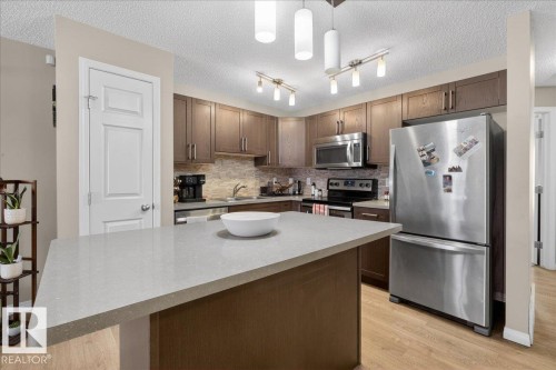 33 4029 Orchards Drive, Edmonton, AB - Indoor Photo Showing Kitchen With Double Sink