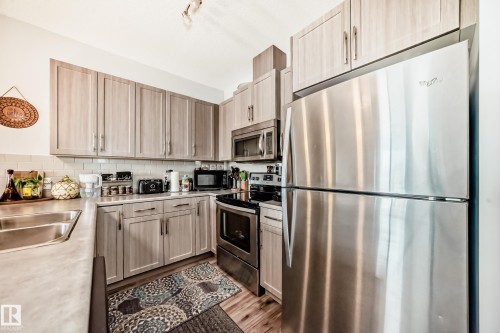 208 812 Welsh Drive, Edmonton, AB - Indoor Photo Showing Kitchen With Stainless Steel Kitchen With Double Sink