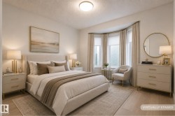 Room featuring wood-finish flooring and a central ceiling light fixture - 