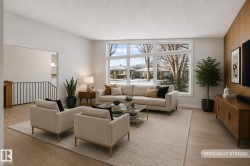 Spacious living area featuring large picture windows, wood-finish flooring, and a neutral color palette - 