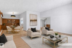 Open concept living area featuring wood-finish flooring and light-toned walls - 