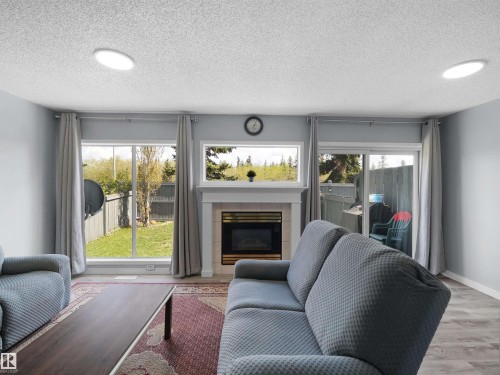 25 501 Youville Drive E, Edmonton, AB - Indoor Photo Showing Living Room With Fireplace