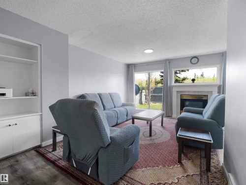25 501 Youville Drive E, Edmonton, AB - Indoor Photo Showing Living Room With Fireplace