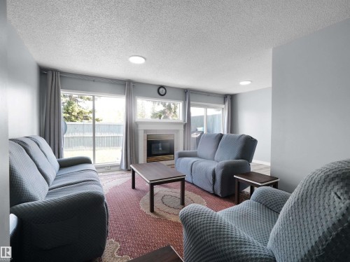 25 501 Youville Drive E, Edmonton, AB - Indoor Photo Showing Living Room With Fireplace