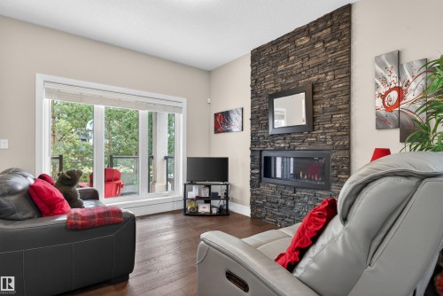1 1030 Connelly Way, Edmonton, AB - Indoor Photo Showing Living Room With Fireplace