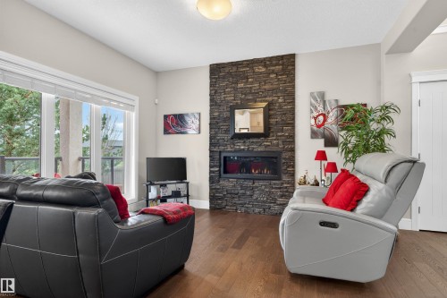 1 1030 Connelly Way, Edmonton, AB - Indoor Photo Showing Living Room With Fireplace