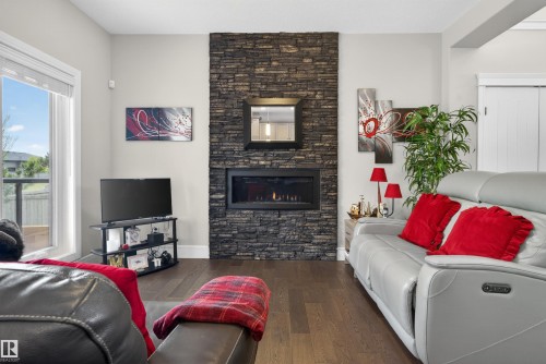 1 1030 Connelly Way, Edmonton, AB - Indoor Photo Showing Living Room With Fireplace