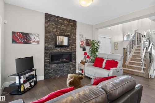 1 1030 Connelly Way, Edmonton, AB - Indoor Photo Showing Living Room With Fireplace