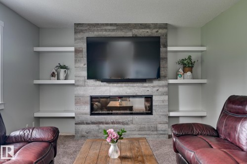 13 Clearwater, Devon, AB - Indoor Photo Showing Living Room With Fireplace