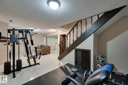 13 Clearwater, Devon, AB - Indoor Photo Showing Gym Room