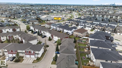 Aerial perspective showcasing a residential community with varied home styles - 11 450 Mcconachie Way, Edmonton, AB - Outdoor With View