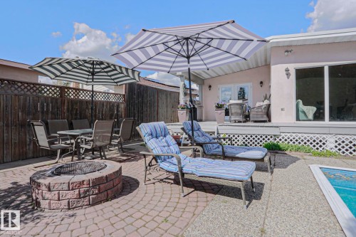 Brick paver patio featuring a built-in fire pit - 1214 85 Street Nw, Edmonton, AB - Outdoor With Deck Patio Veranda
