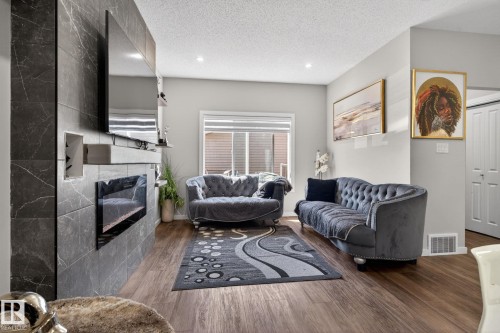 262 Rolston Wynd, Leduc, AB - Indoor Photo Showing Living Room With Fireplace